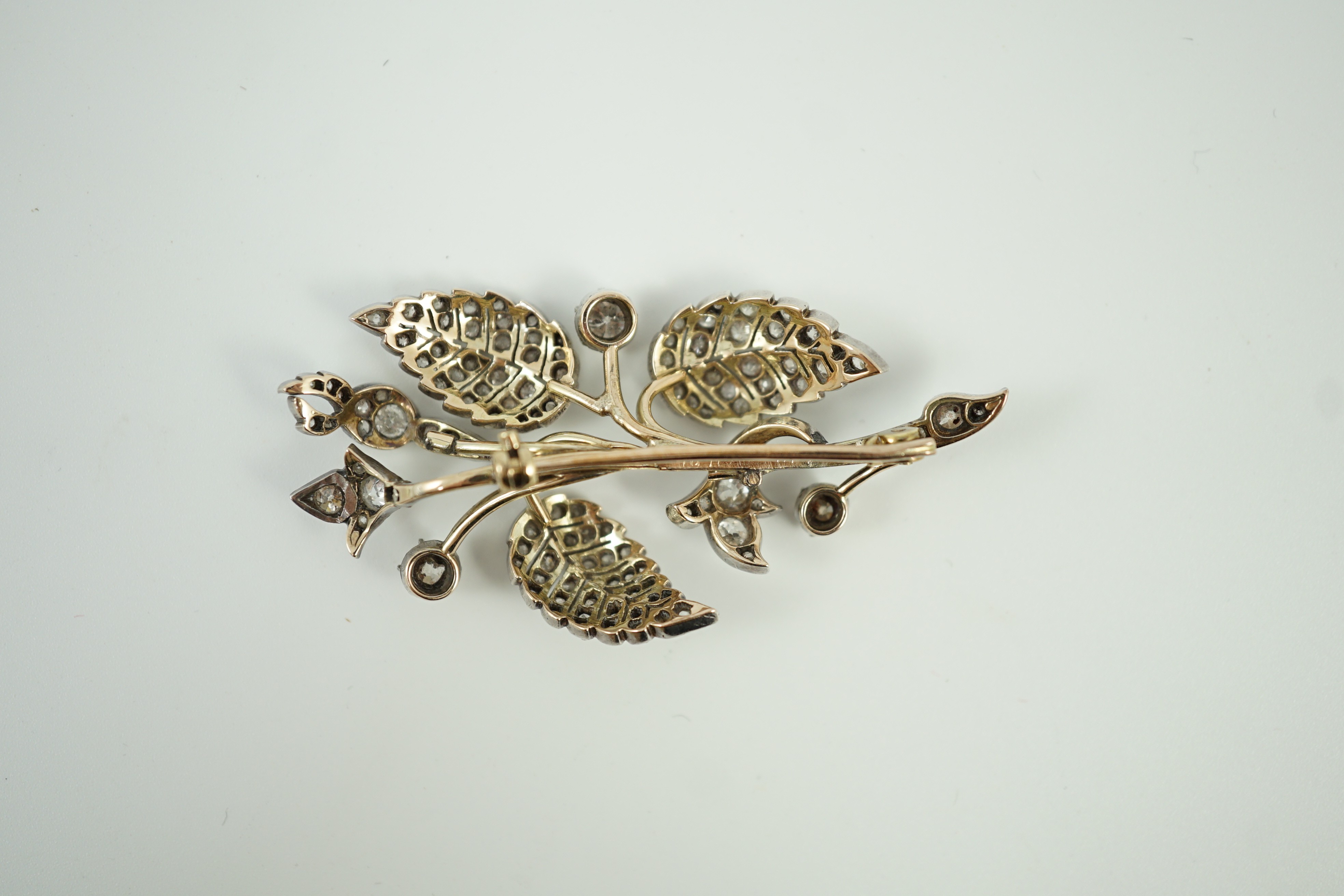 A mid 20th century yellow and white metal, diamond cluster set floral spray brooch, 61mm, gross weight 15.5 grams.